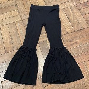 Black bell bottom pants with ruffle detail